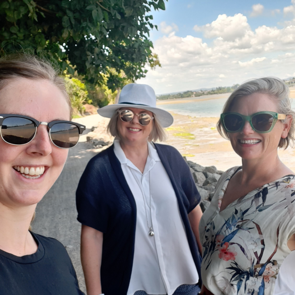 Three staff members walking for wellness