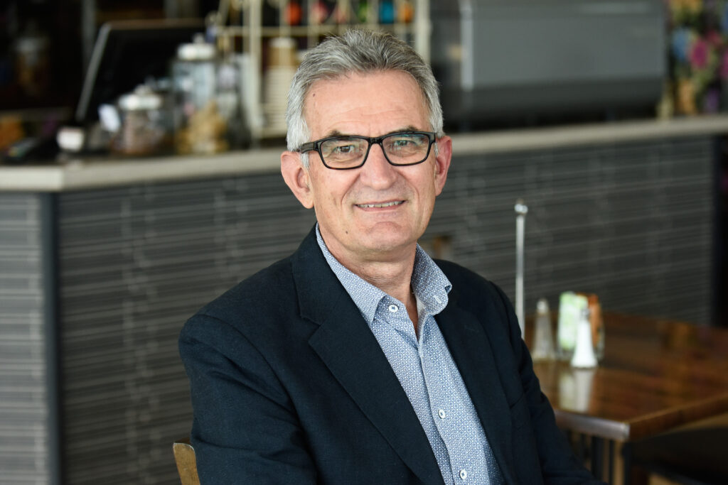 Stan Gregec sits in a cafe