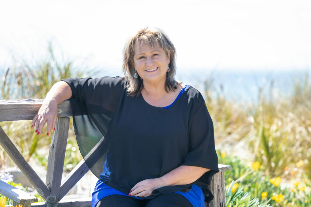 Tanya Dunham from TDRealty sitting by the beach