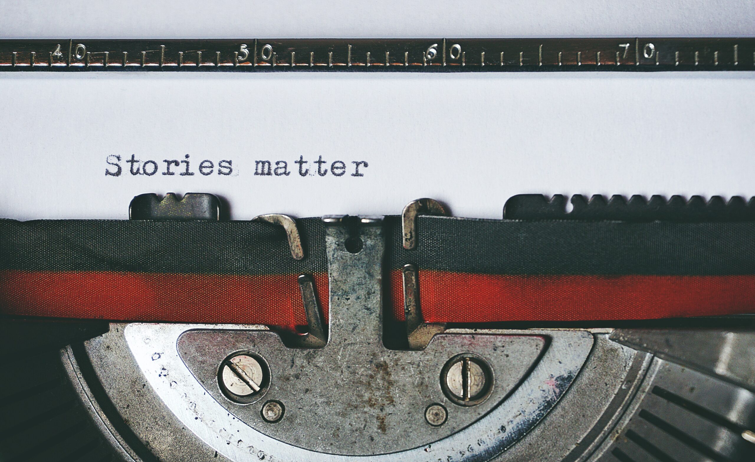 The words Stories matter written on a typewriter